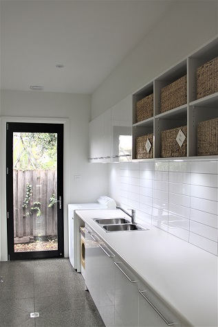 Laundry cupboards with overhead cupboard storage and benchtop
