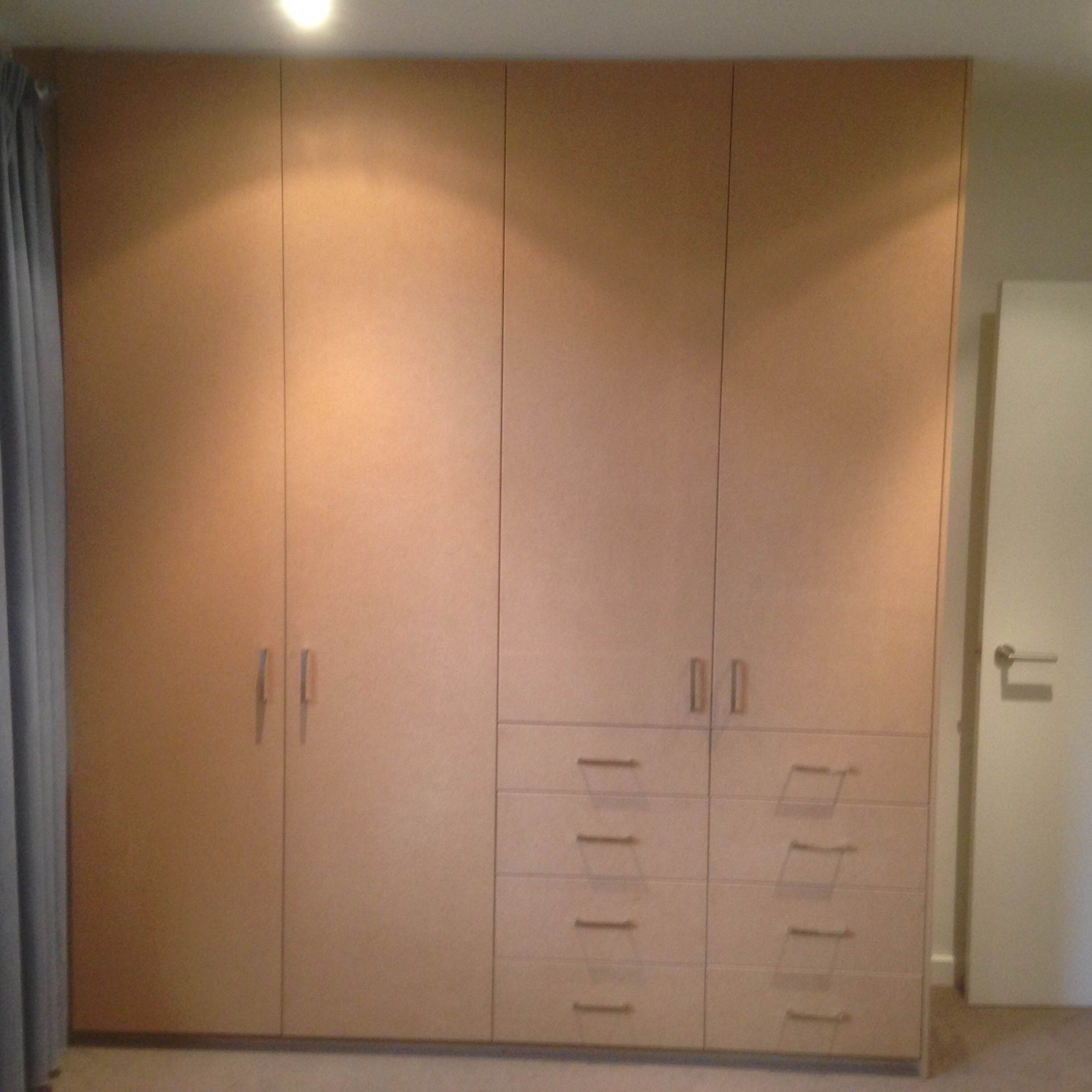 Raw plain MDF doors with exposed drawer fronts