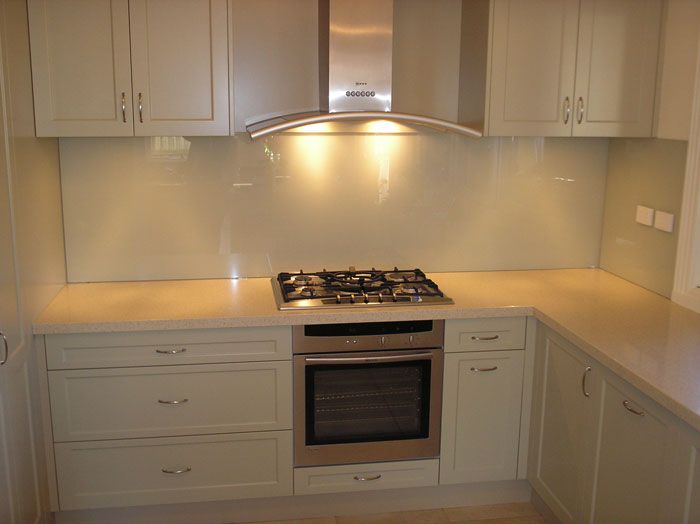 White vinyl wrap kitchen with white glass splashback