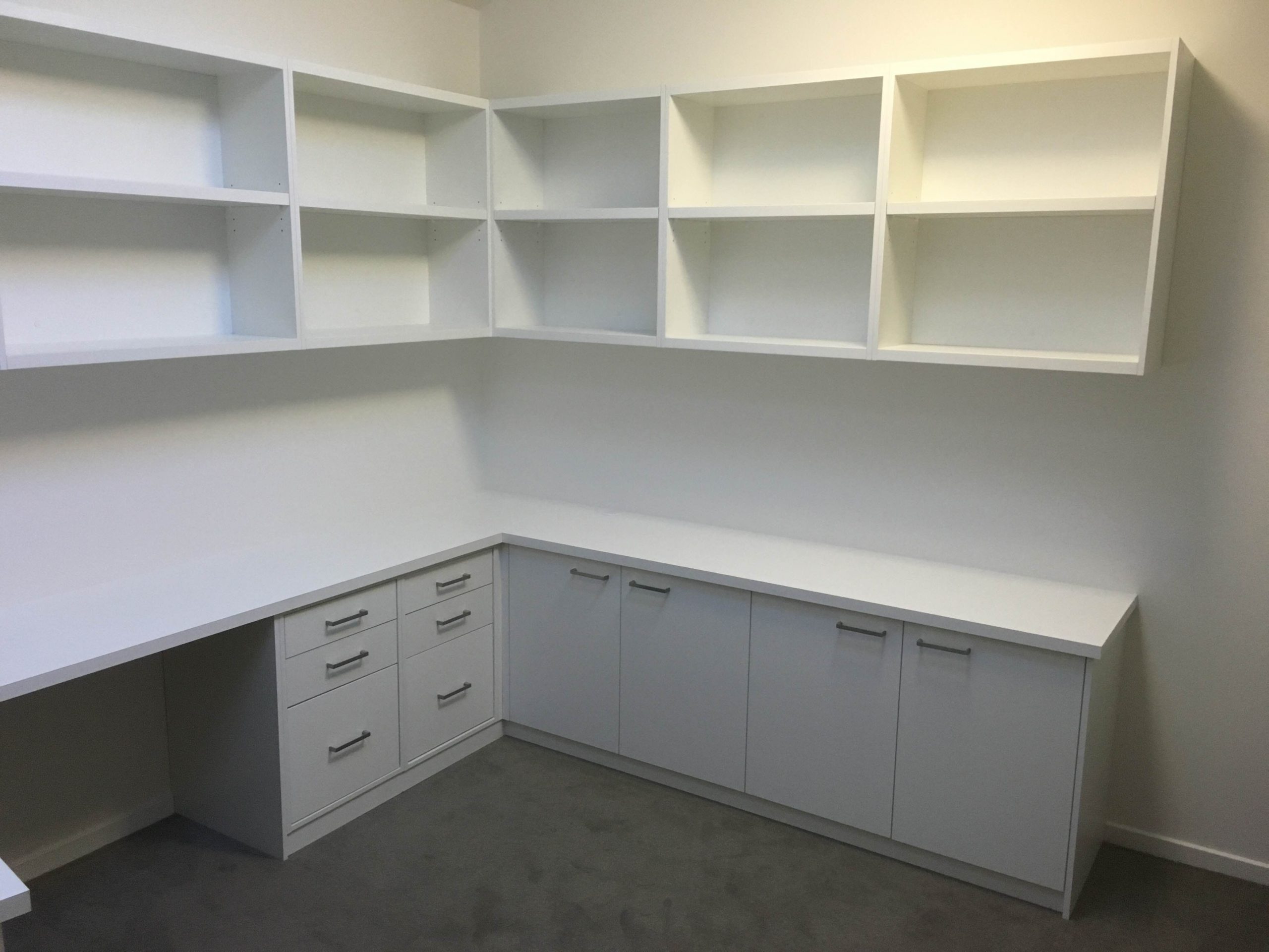 custom made desk in white melamine with cupboards and drawers