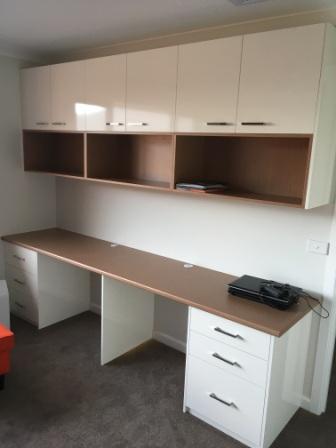 custom made desk with cupboards and shelves