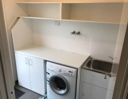 laundry cupboards, benchtop and shelving