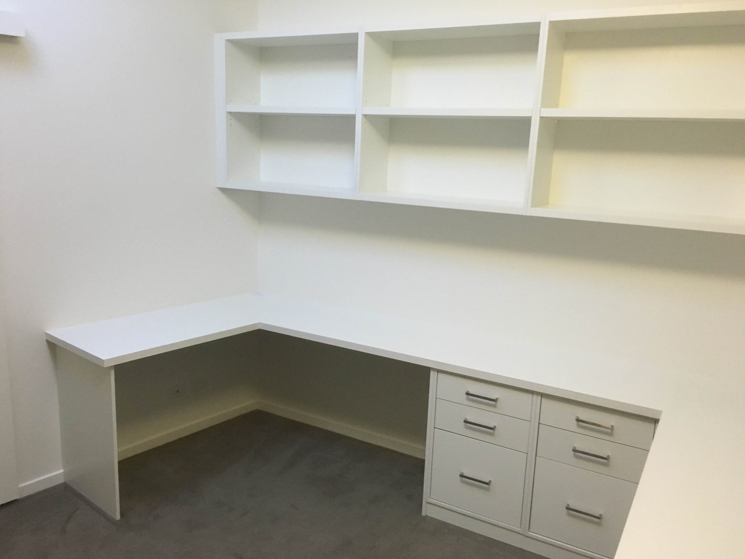 study area with desk, drawers and shelves