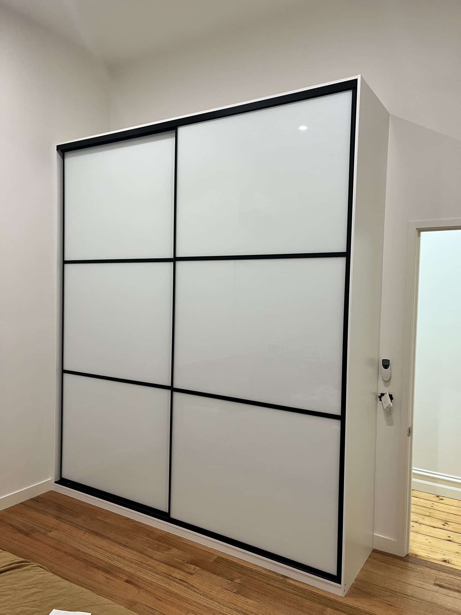 panelled door wardrobe white glass panels with black frame 3 panel sliding door wardobe scaled