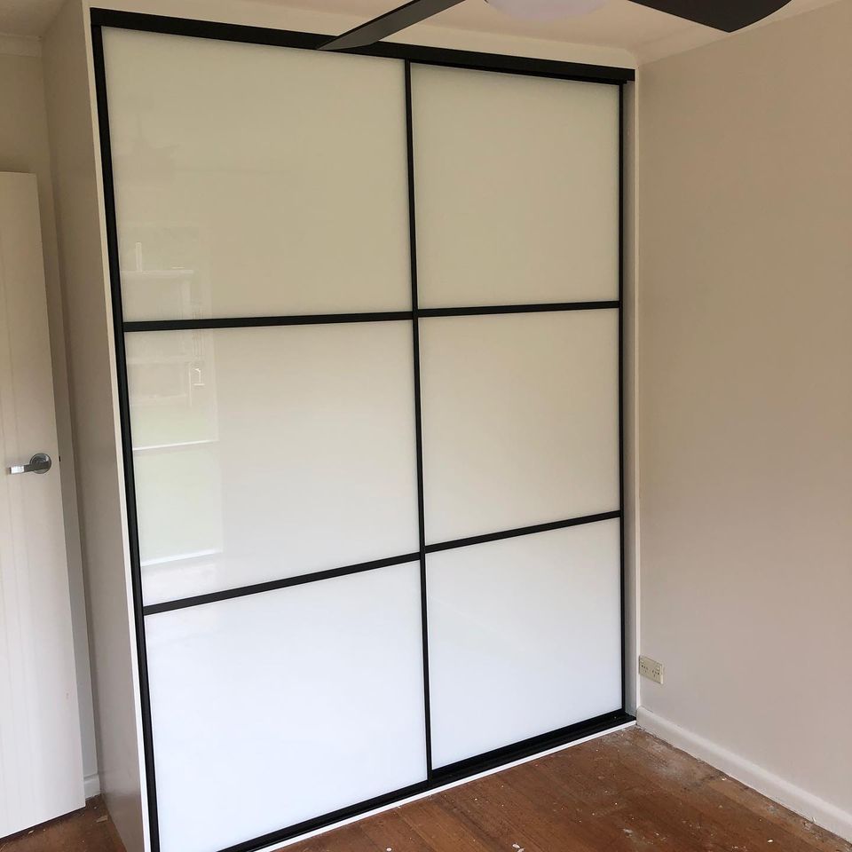 sliding wardrobe white glass with black frame